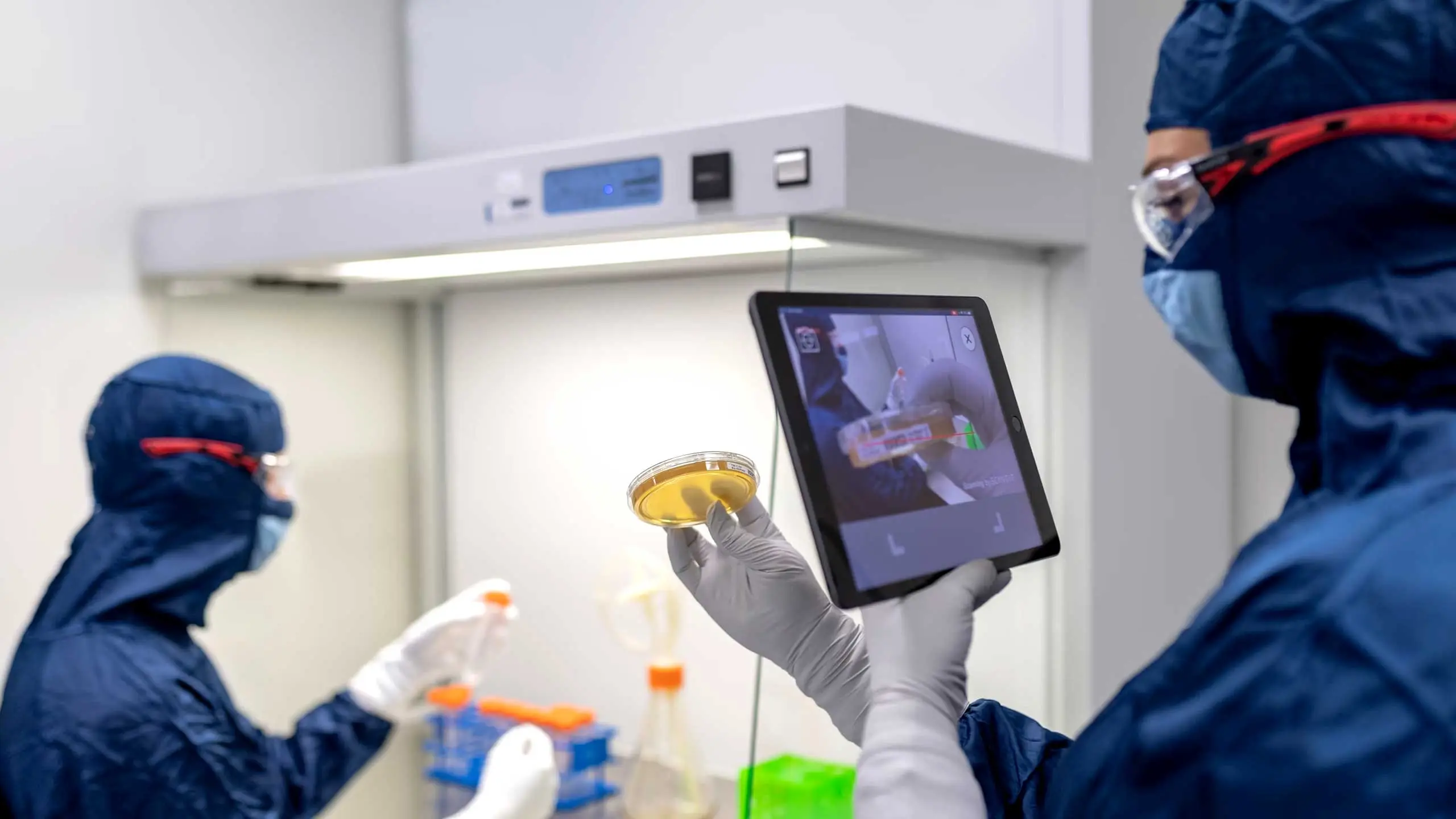 AI Data for Life Sciences Scientists and data consultants working together on a clinical trial data platform.