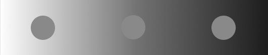 Color Saturation Illusion three circles on a black gradient appear different colors, but are all the same