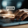 Person typing on a computer keyboard with chat bubbles overlayed on the screen.